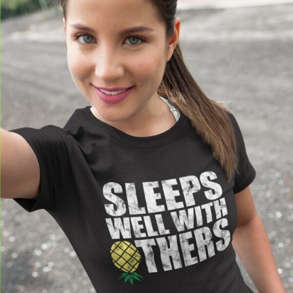 Woman wearing our 'sleeps well with others' pineapple lifestyle/swingers tshirt