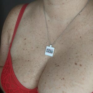 Woman wearing a hall pass necklace