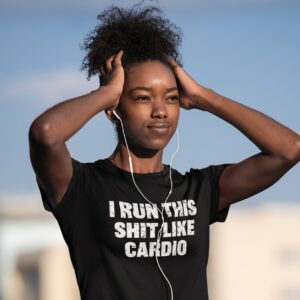 girl wearing an I run this shit like cardio t-shirt