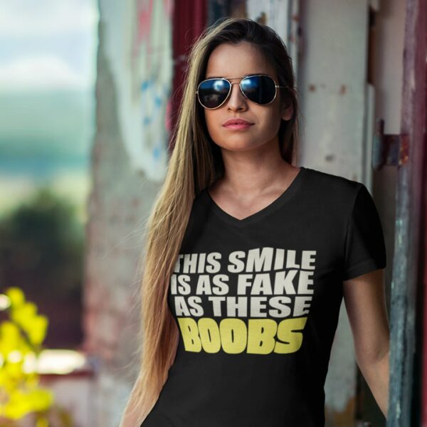 Woman wearing a 'this smile is as fake as these boobs' t-shirt