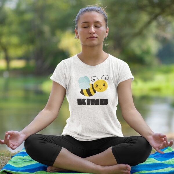 Yoga teacher wearing Bee Kind women's t-shirt