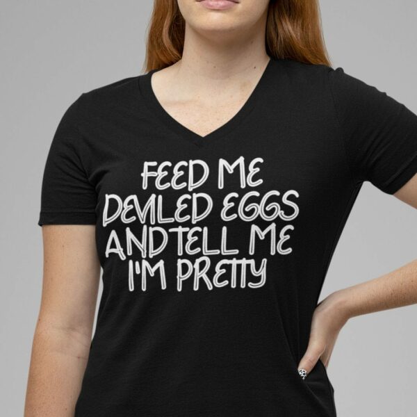 woman wearing a feed me deviled eggs and tell me I'm pretty v-neck t-shirt