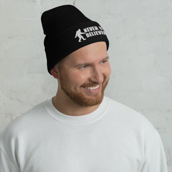 man wearing a Bigfoot never stop believing beanie