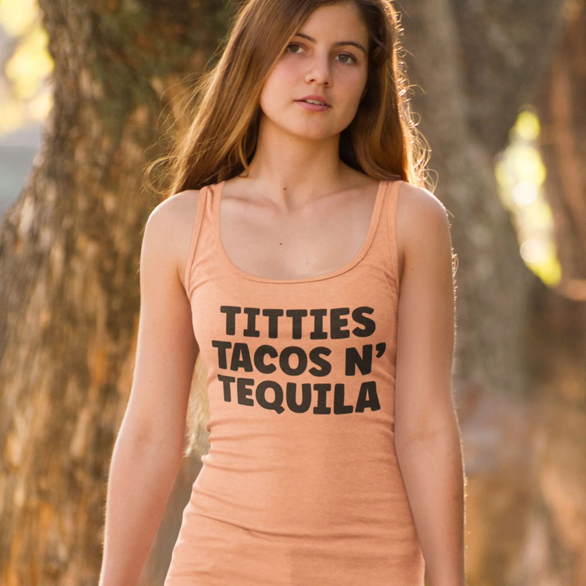 woman wearing a titties, tacos, n' tequila women's racerback tank top